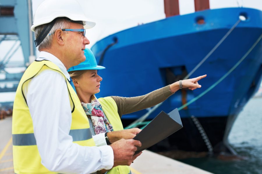 ship-hunt-two-dock-workers-conferring-among-themselves-while-surveying-harbor Two dock workers conferring among themselves while surveying the harbor.