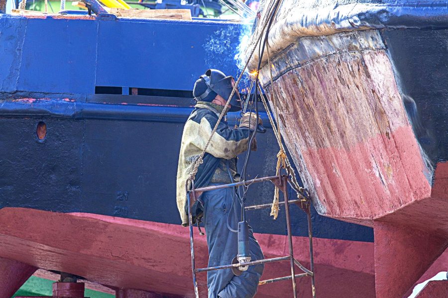 a welder working on a repair ship a welder working on a repair ship on Kamchatka